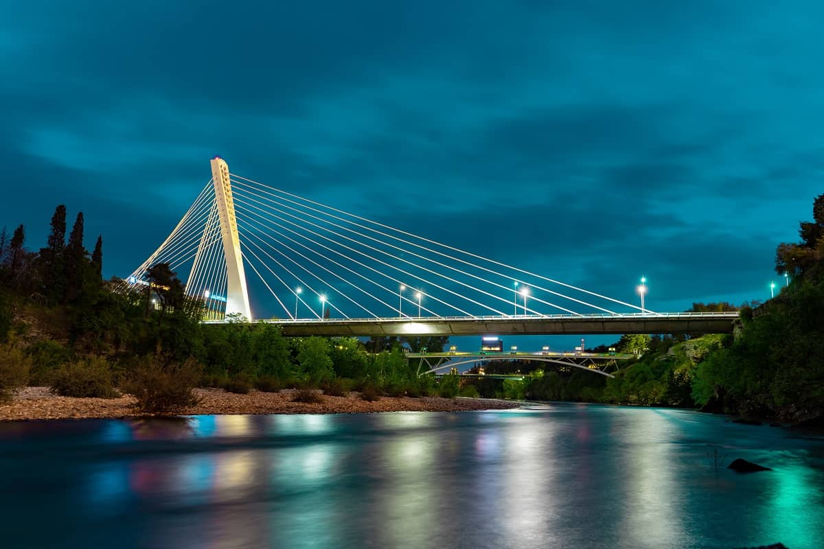 The symbol of Podgorica - Millenium bridge, during the night. Also, another Podgorica bridge is visible behind.